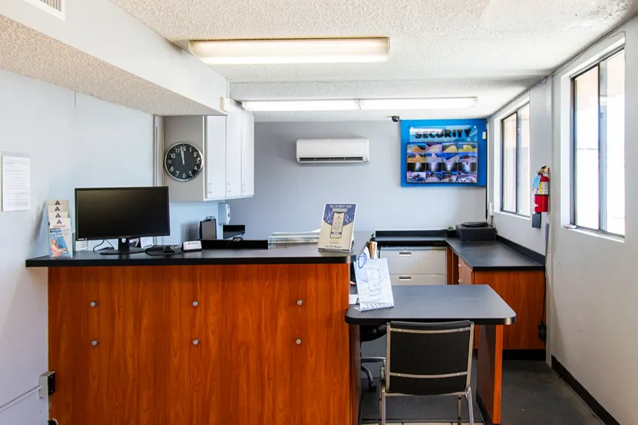 Self storage office interior with customer service desk and workspace